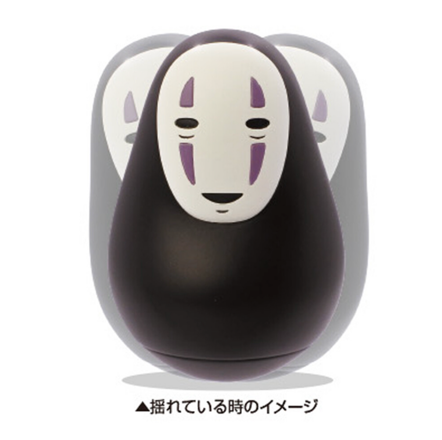 No-Face character from Spirited Away holding a teacup, designed as a wobbly roly-poly figure that tilts and balances upright
