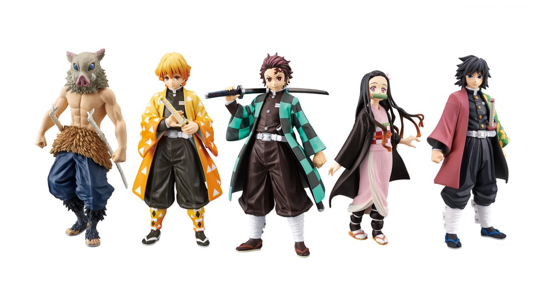 The main characters of Demon Slayer – Tanjiro, Nezuko, Zenitsu, and Inosuke standing together