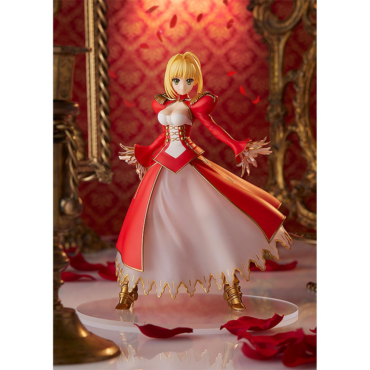 Nero Claudius Pop Up Parade figure in bright red dress, smiling confidently with arms raised.