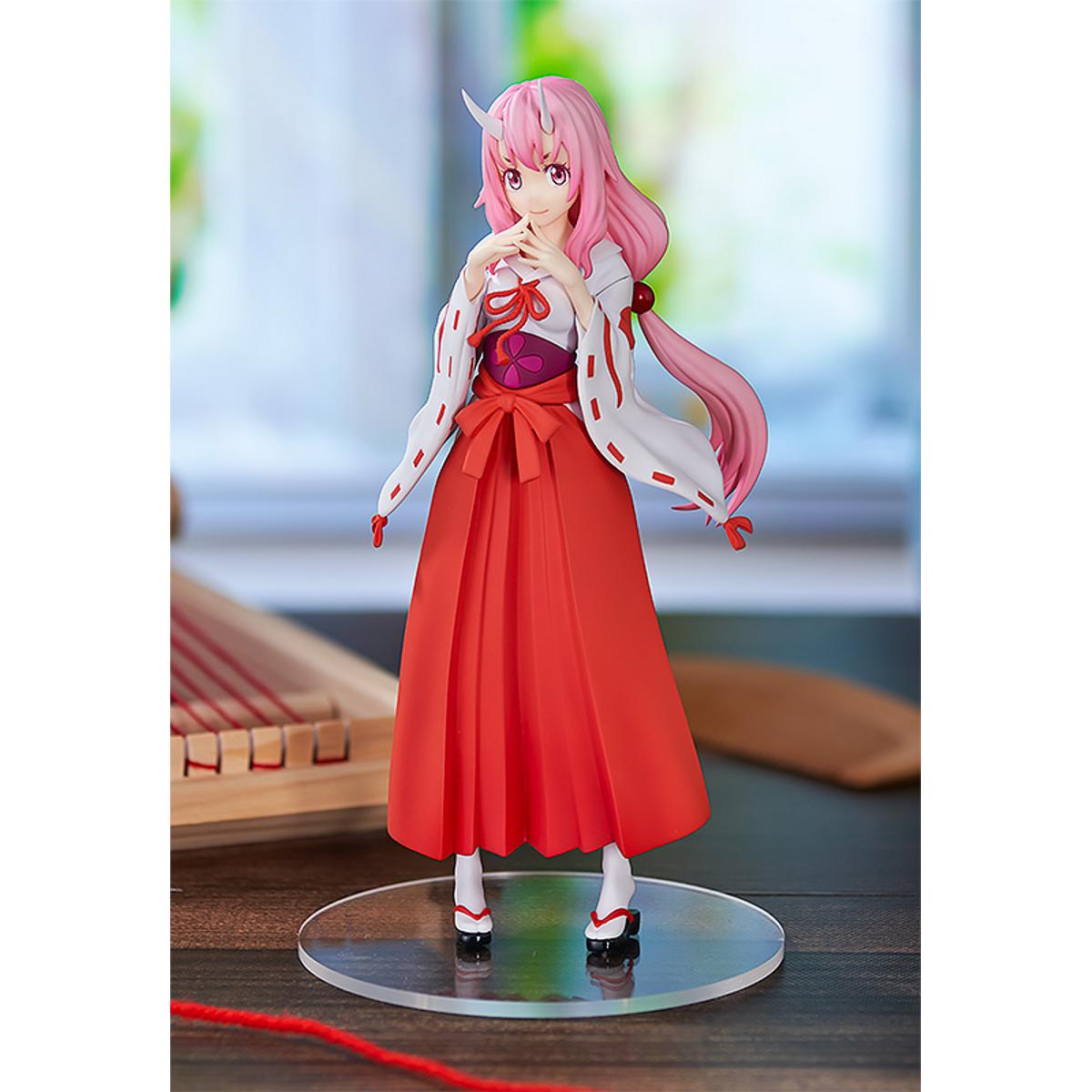 Shuna Pop Up Parade figure in traditional pink outfit, standing with hands together and calm expression.