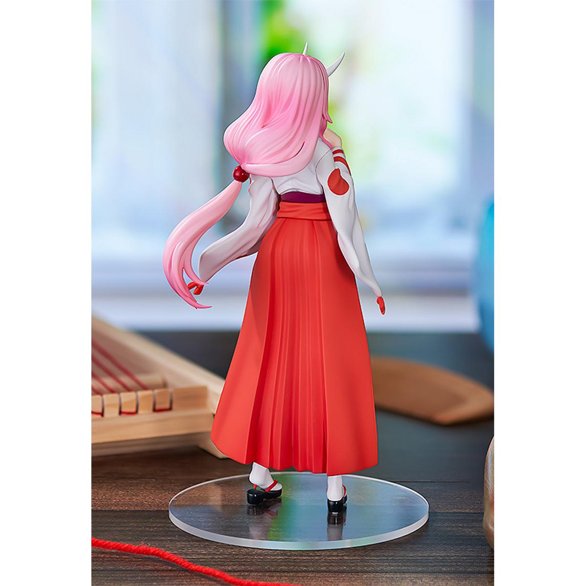 Shuna Pop Up Parade figure in traditional pink outfit, standing with hands together and calm expression.