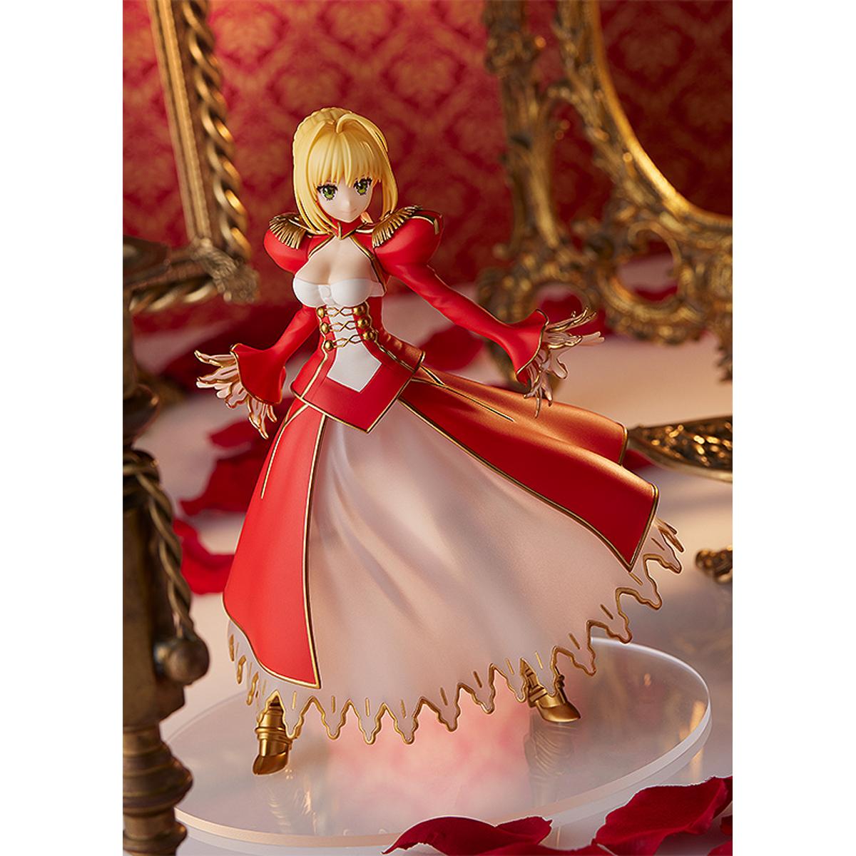 Nero Claudius Pop Up Parade figure in bright red dress, smiling confidently with arms raised.
