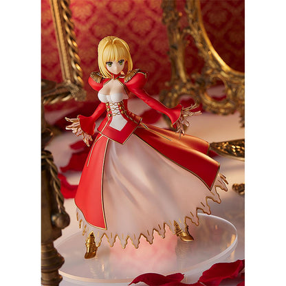 Nero Claudius Pop Up Parade figure in bright red dress, smiling confidently with arms raised.