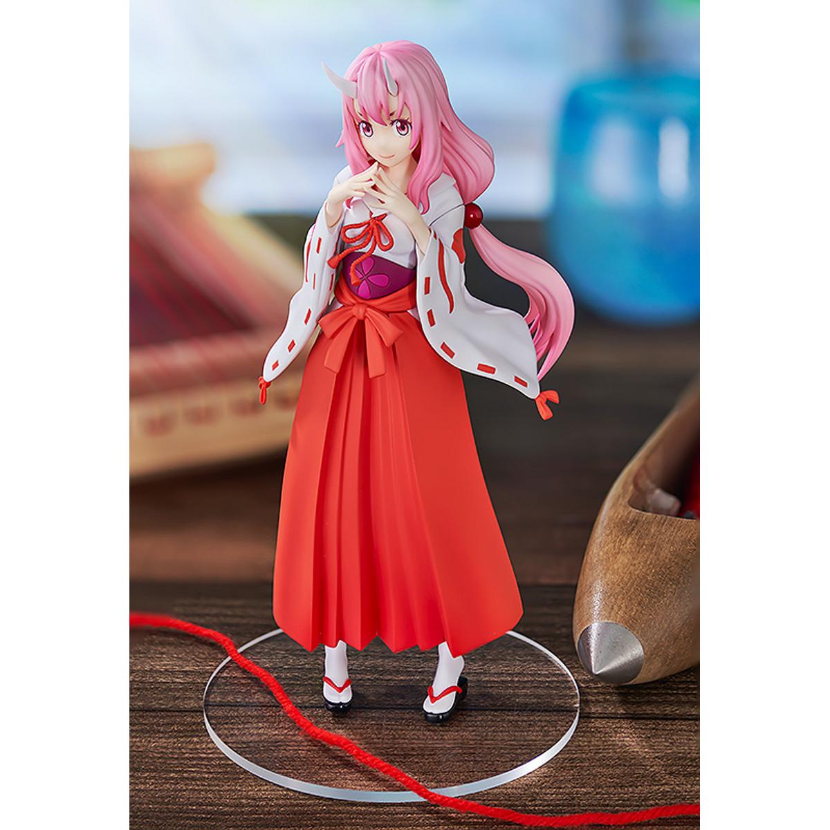 Shuna Pop Up Parade figure in traditional pink outfit, standing with hands together and calm expression.