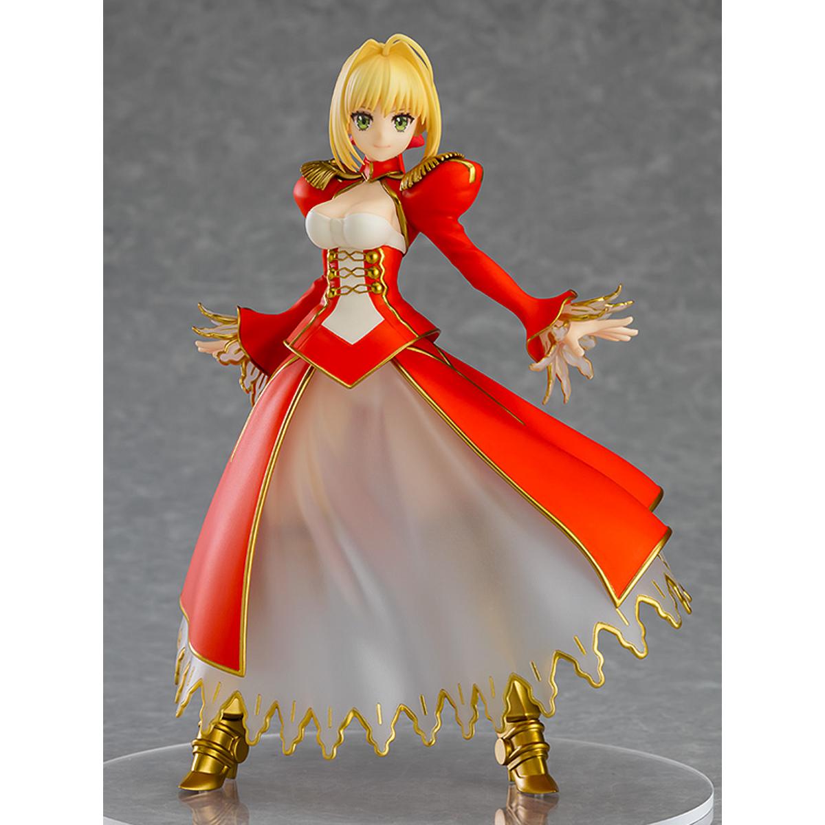 Nero Claudius Pop Up Parade figure in bright red dress, smiling confidently with arms raised.