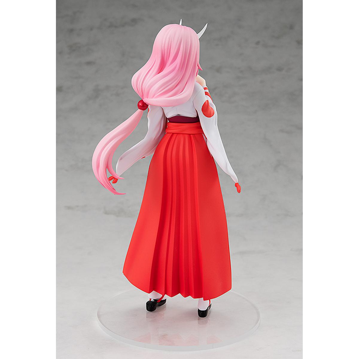 Shuna Pop Up Parade figure in traditional pink outfit, standing with hands together and calm expression.