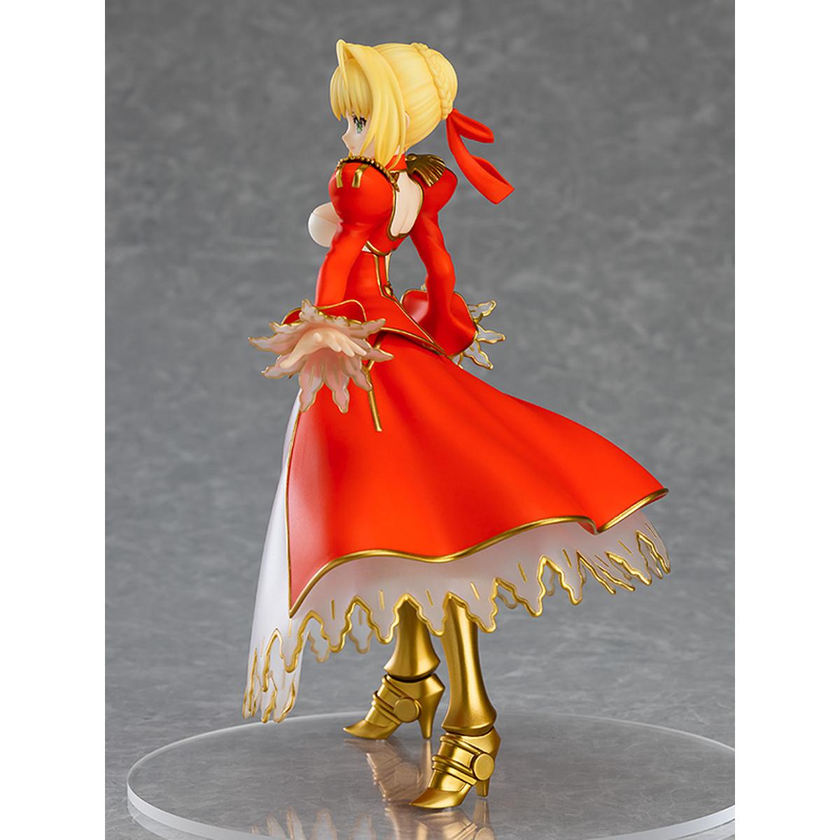 Nero Claudius Pop Up Parade figure in bright red dress, smiling confidently with arms raised.